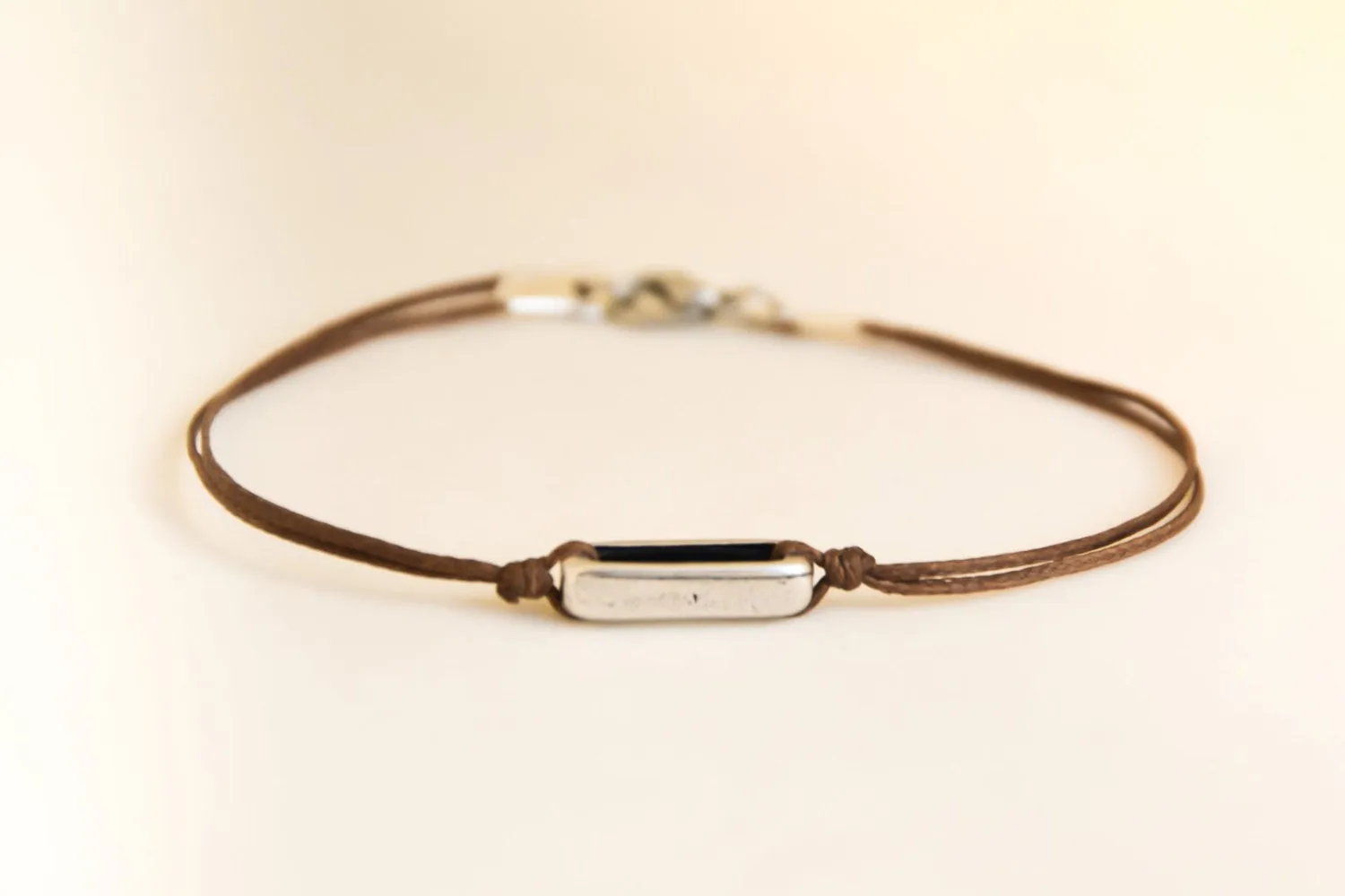 Men's bracelet with a silver rectangle bead, Brown cord